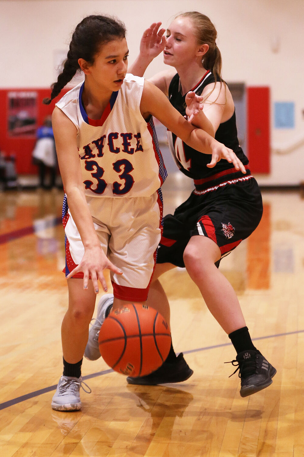 Denise Ortega-Chavez dribbles toward center court before passing to teammate Jackie Ramirez
